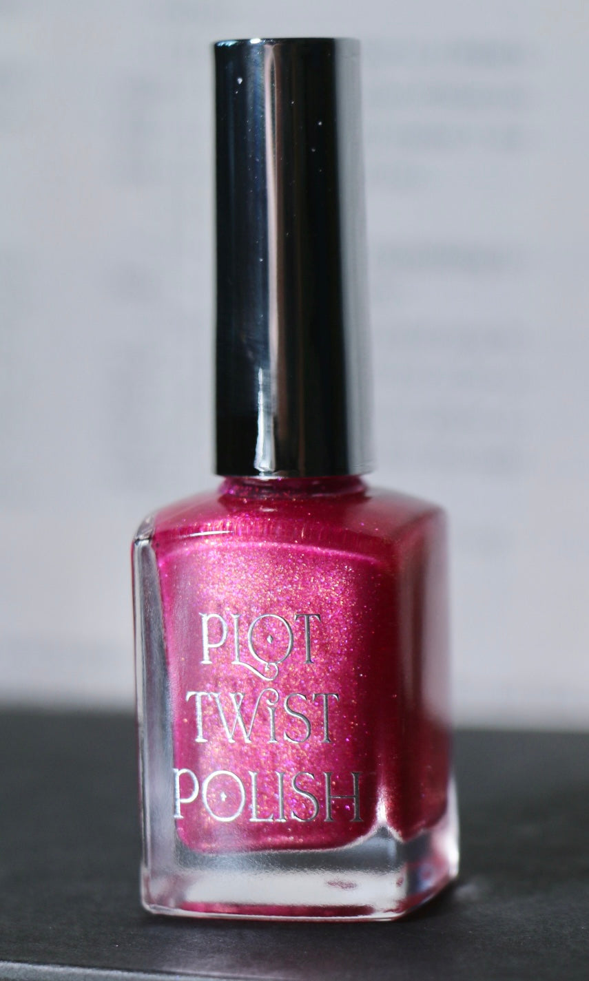 A bottle of Plot Twist Polish nail lacquer in a shimmering magenta-pink shade, featuring a glossy silver cap and clear glass bottle.
