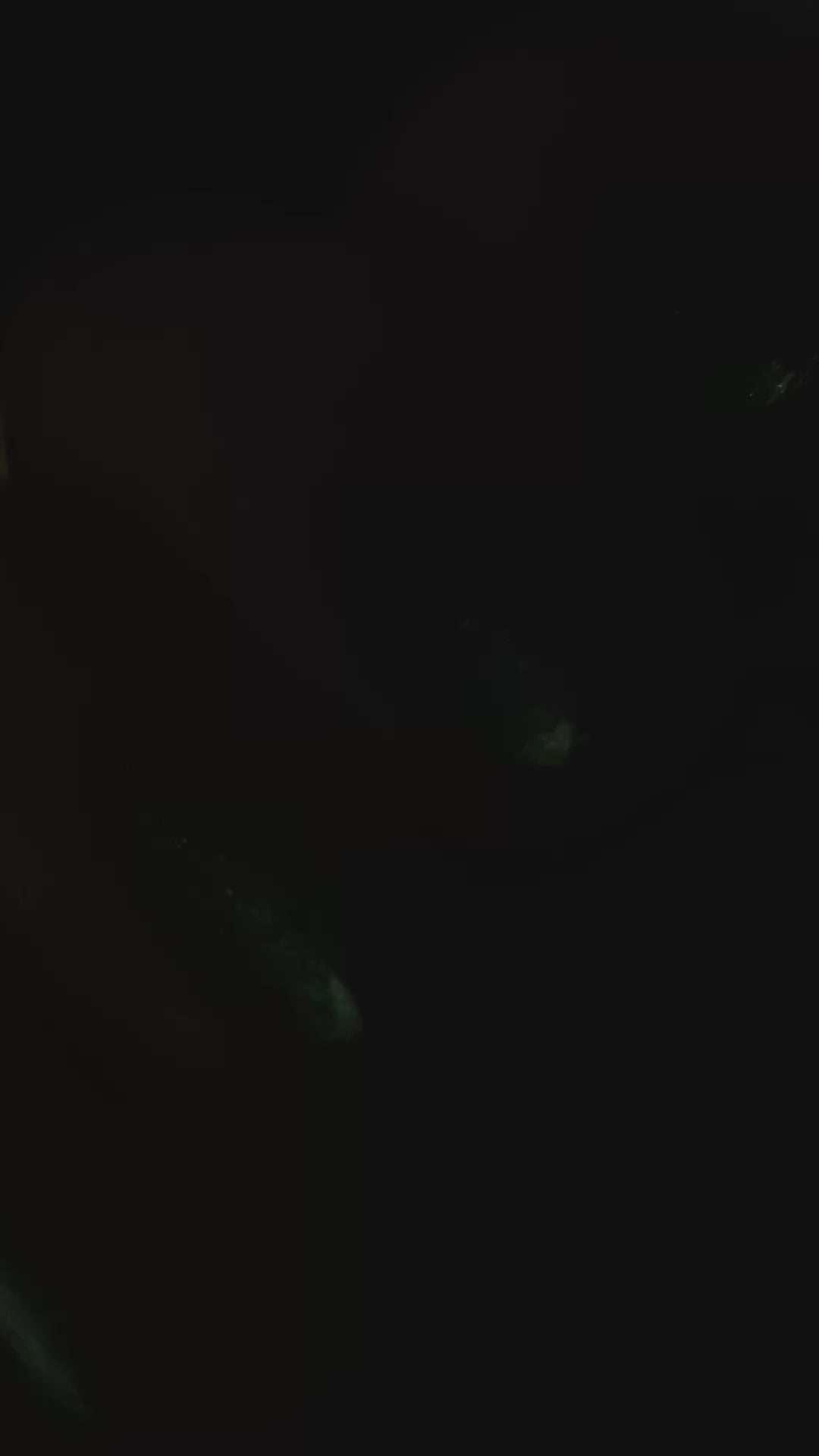 A close up video of blue green nails with a light that moves over top.