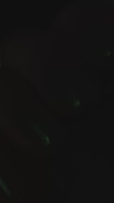 A close up video of blue green nails with a light that moves over top.